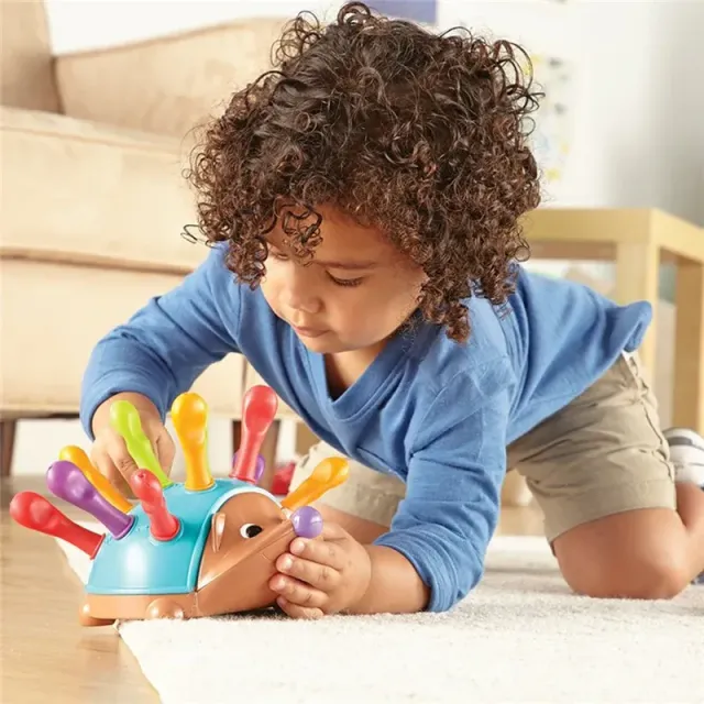 Children's educational toy in the shape of a hedgehog for the development of fine motor skills