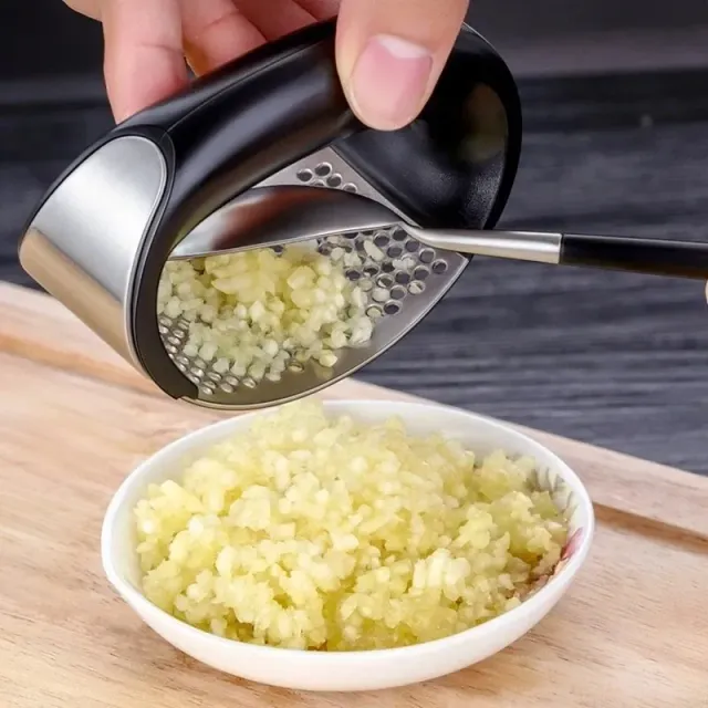 Hand-operated garlic press made of stainless steel