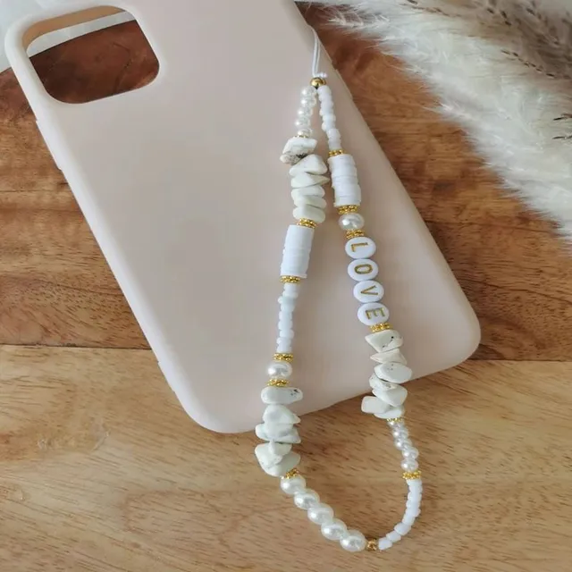 Joli pendentif de téléphone avec perles et coquillages