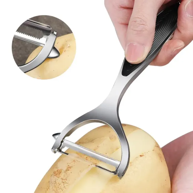 Stainless steel vegetable peeler with rubber holder