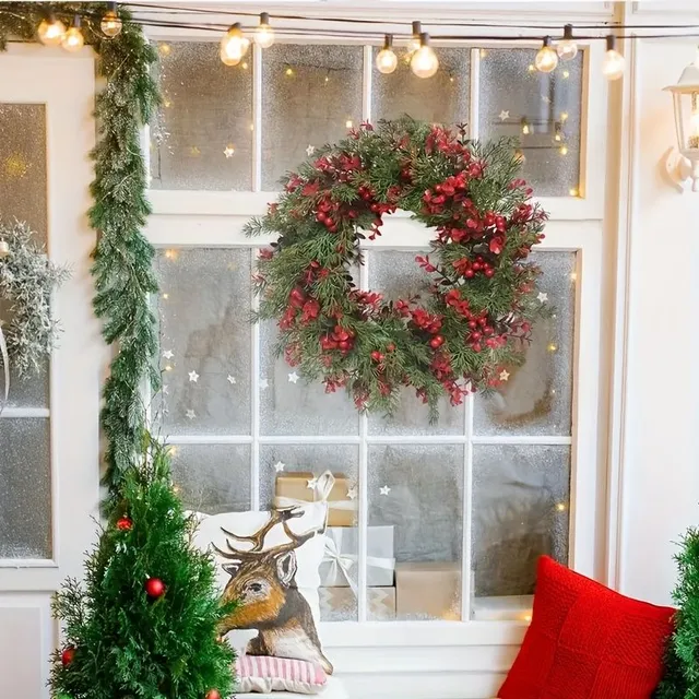 Christmas wreath with red berries and artificial eucalyptus