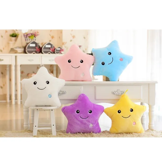 Beautiful plush glowing cushion in the shape of a star