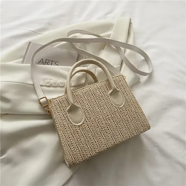 Ladies square beach bag made of rattan with top handle