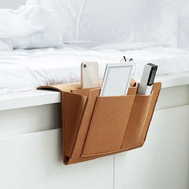 Hinged organizer to bed