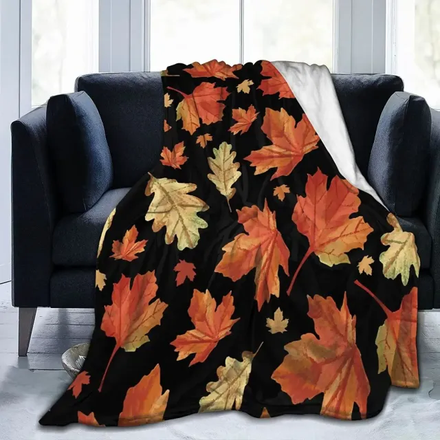 Autumn flannel blanket with a motif of pumpkins and leaves for sofa, bed or couch