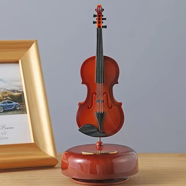 Vintage wooden rotating violin in the shape of music