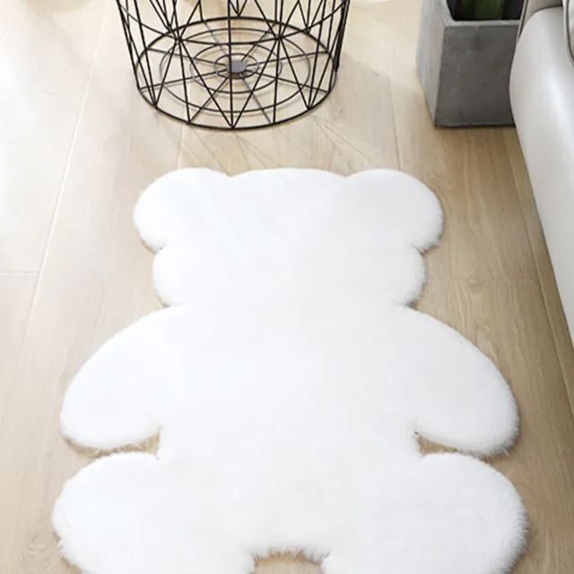 Soft rug in the shape of a teddy bear