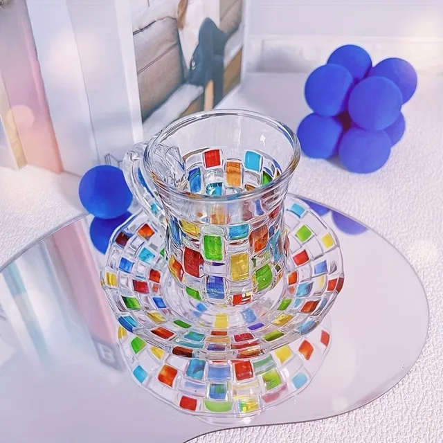 Set of coloured glass cups with saucers