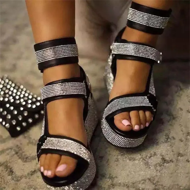 Summer strap sandals decorated with rhinestones on a high platform