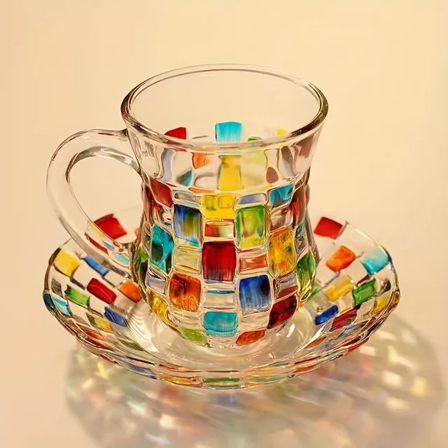 Set of coloured glass cups with saucers