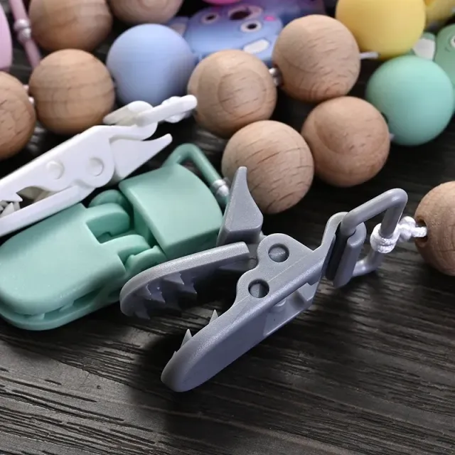 Silicone pacifier clip with bite and pet motif