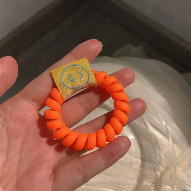 Fluorescent spiral rubber with smiley face