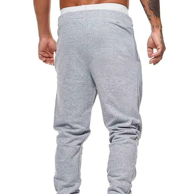 Men's streetwear track pants with print and drawstring waist, ideal for outdoor sports