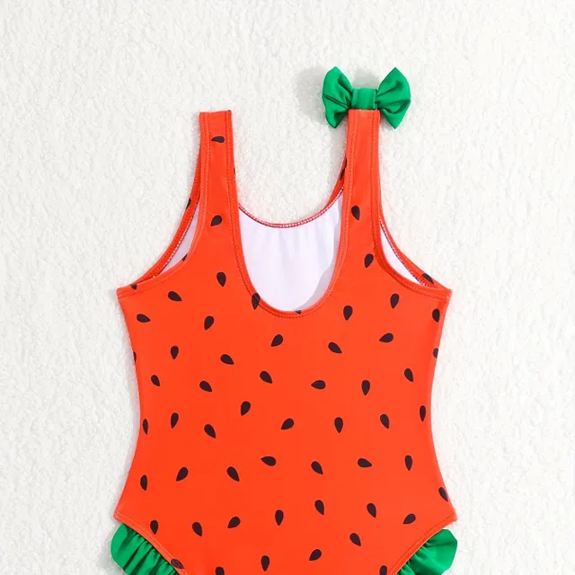 One-piece swimsuits for girls with a motif of watermelon and bows on hangers