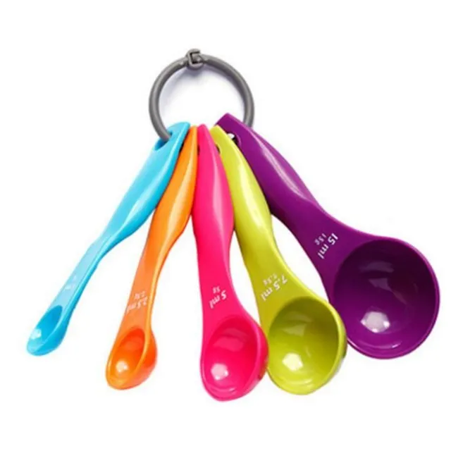 Sets of coloured measuring cups on a ring