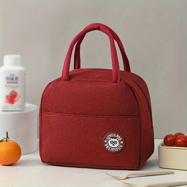 Practical insulated lunch bag with cheerful motif, handles and thermal insulation