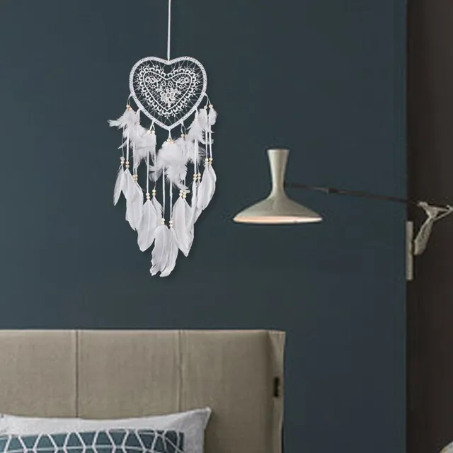 Beautiful heart-shaped dream catcher with feathers and beads