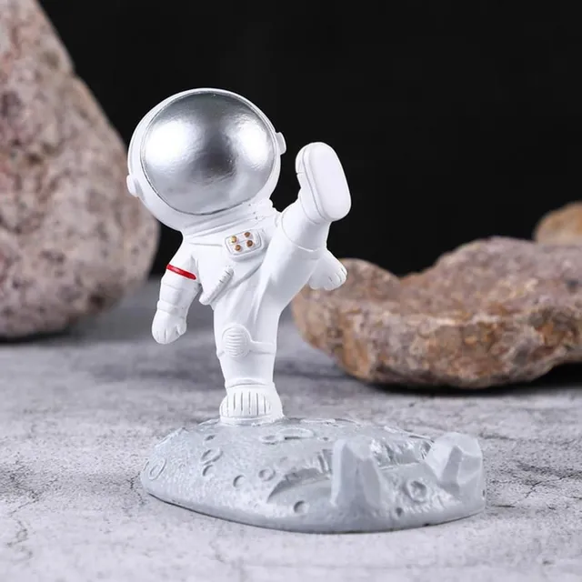 Praktický stojan ve tvaru kosmonauta na mobilní telefon