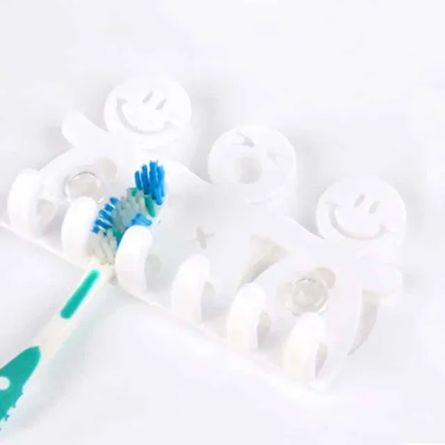 Wall bracket for toothbrushes