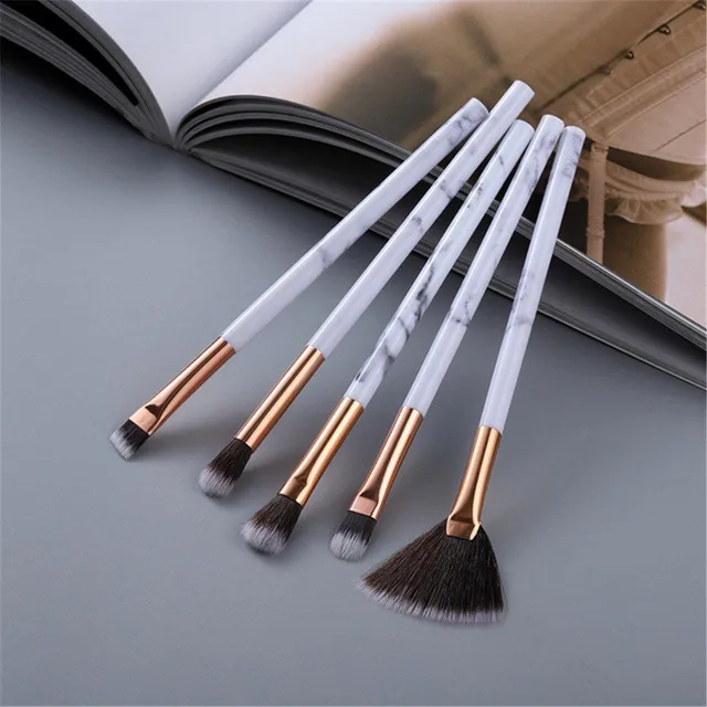 Set of make-up brushes in marble design