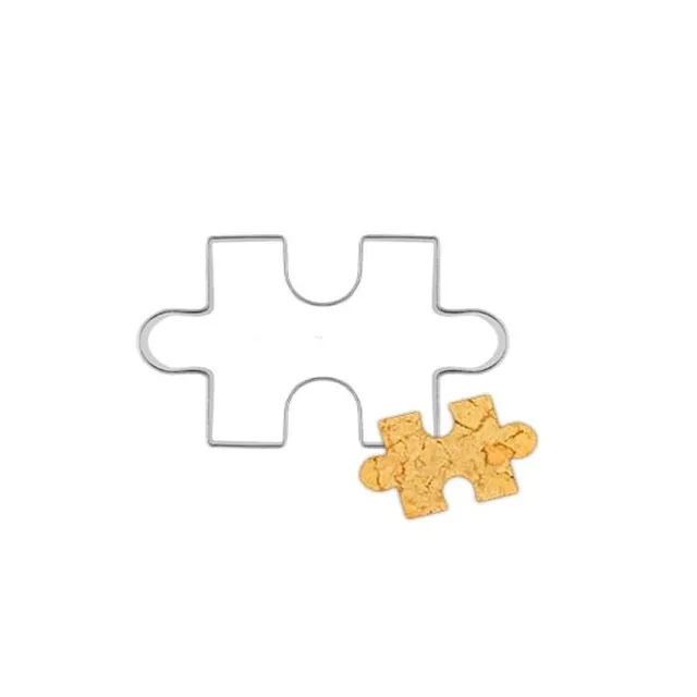 Stainless steel cookie cutter in the shape of a puzzle
