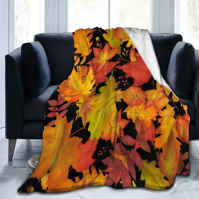 Autumn flannel blanket with a motif of pumpkins and leaves for sofa, bed or couch