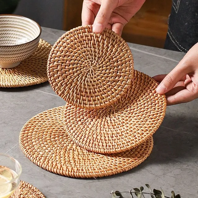 Modern knitted trendy favorite rattan coaster on the table under the cup