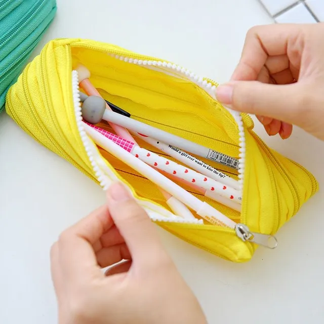 A colorful small school pencil with funny, moving eyes - different colors