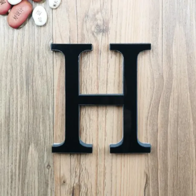 Decorative minimalist single-colored letters with light reflection for beauty of home