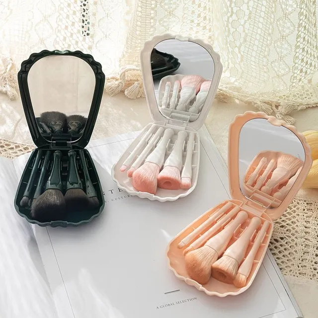 Design set of fine cosmetic brushes in practical packaging with mirror in shell shape