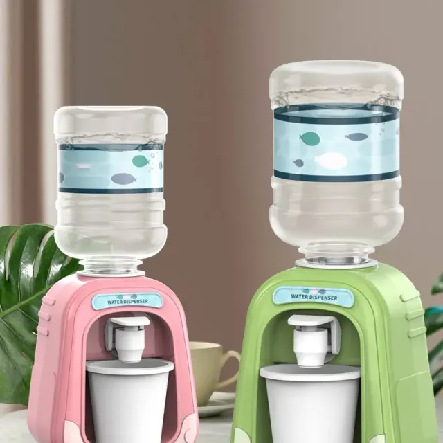 Mini water dispenser for children with cute motif for simulation of cold/hot water