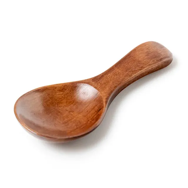 Wooden teaspoon, honey, coffee, spices and other kitchen ingredients