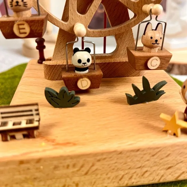 Wooden music box with moving carousel and pets