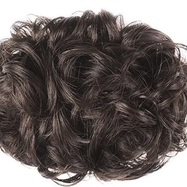 Curly hairpiece on the rack