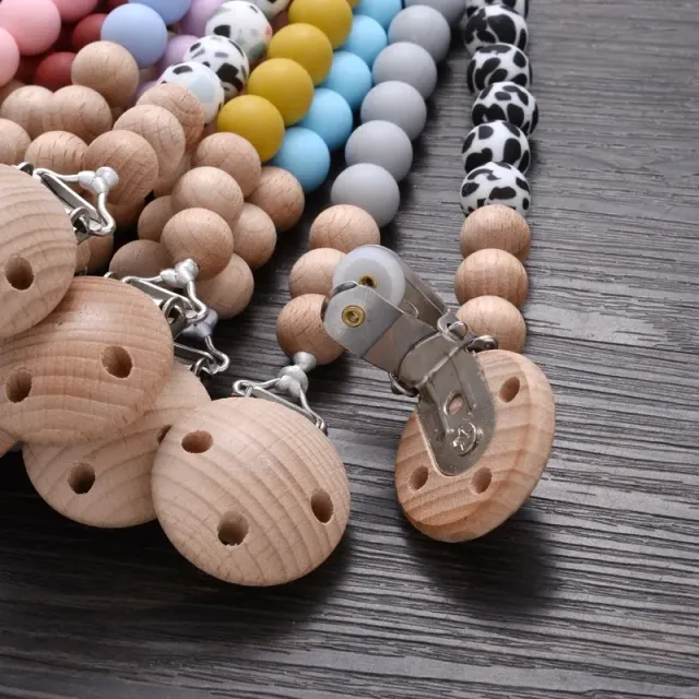 Wooden pacifier clip with silicone bite and round beads