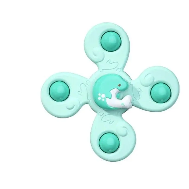 Rotating toy with suction cup for small children