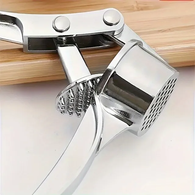 Stainless steel garlic and ginger press - practical kitchen helper for crushing and cutting