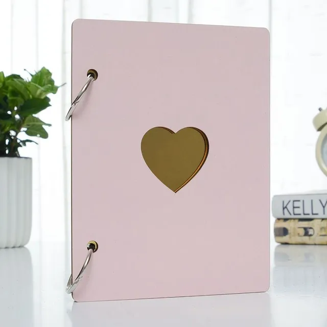 Wooden photo album with a heart in the middle