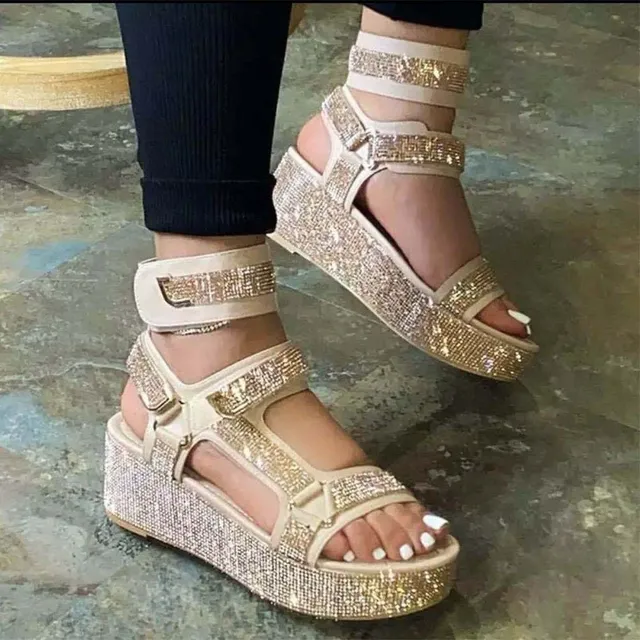 Summer strap sandals decorated with rhinestones on a high platform