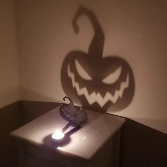 Kreativní projekční svícen pro Halloweenskou atmosféru s projekcí stínu děsivých svíček