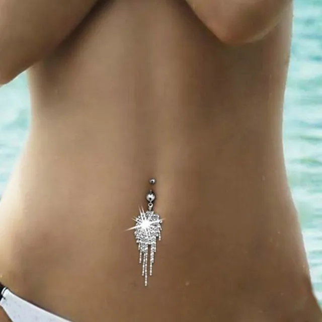 Silver piercing in the belly button with pendant