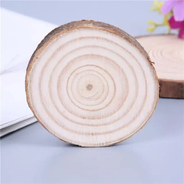 Natural round wooden coaster under a cup for tea, coffee or drinks