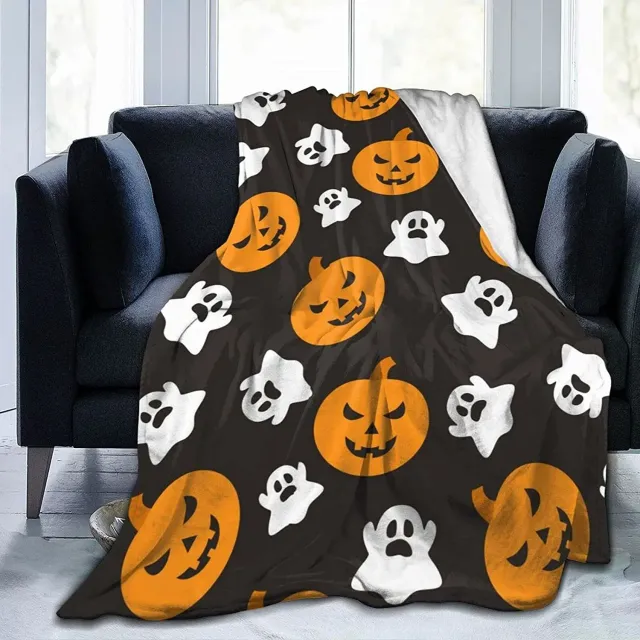 Autumn flannel blanket with a motif of pumpkins and leaves for sofa, bed or couch