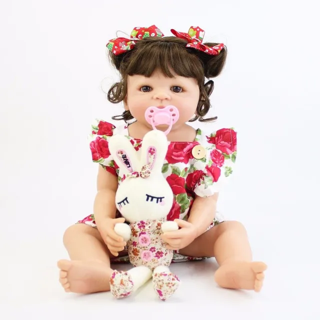 Realistic doll with accessories 55 cm