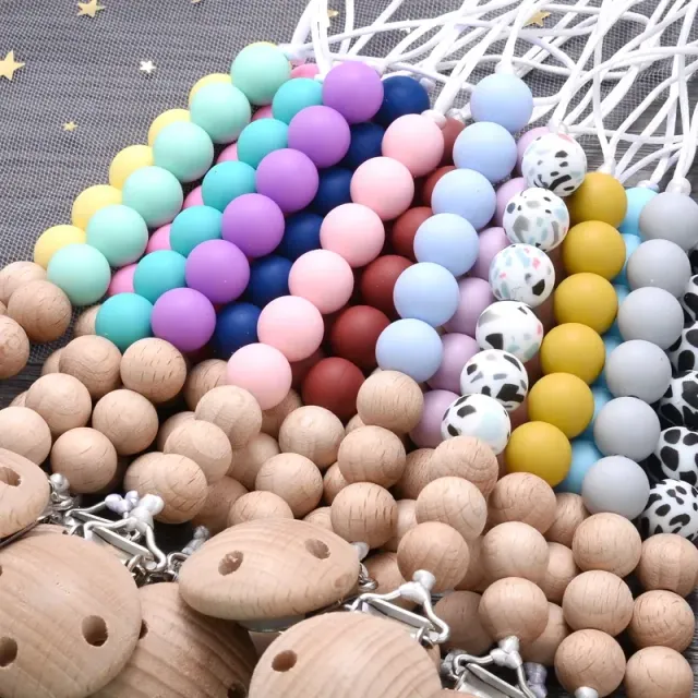 Wooden pacifier clip with silicone bite and round beads