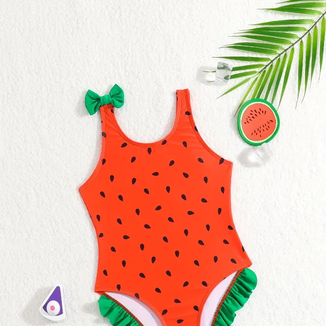 One-piece swimsuits for girls with a motif of watermelon and bows on hangers