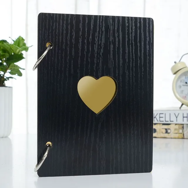 Wooden photo album with a heart in the middle