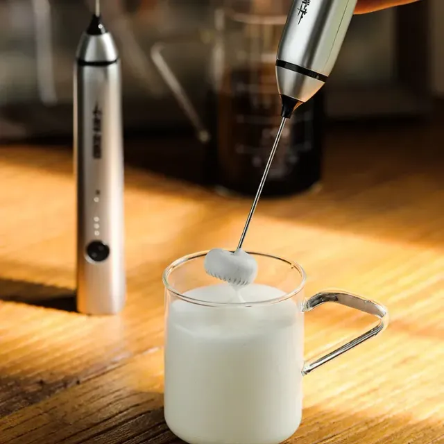 Powerful mini electric milk foamer with stainless steel whip for perfect coffee foam