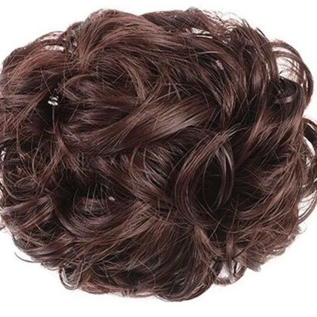 Curly hairpiece on the rack