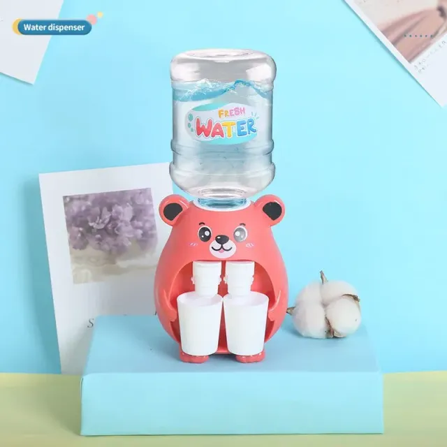 Mini water dispenser for children with cute motif for simulation of cold/hot water